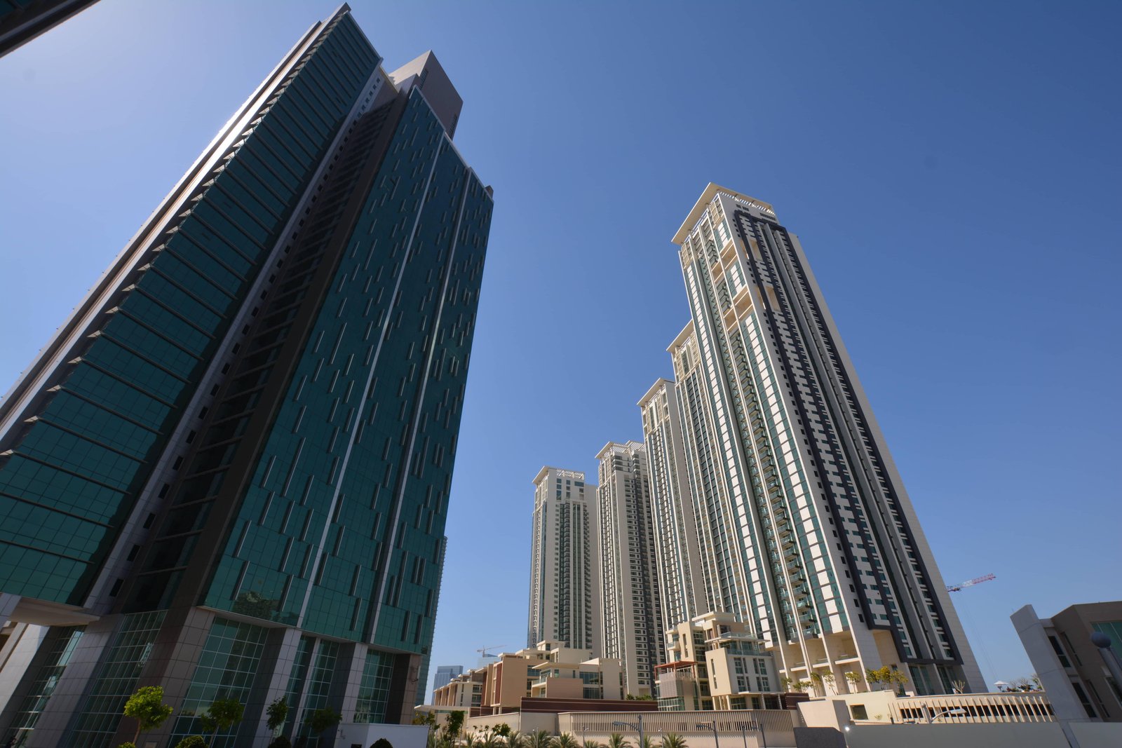 Marina Square waterfront towers with landscaped gardens and promenade views on Al Reem Island Abu Dhabi.